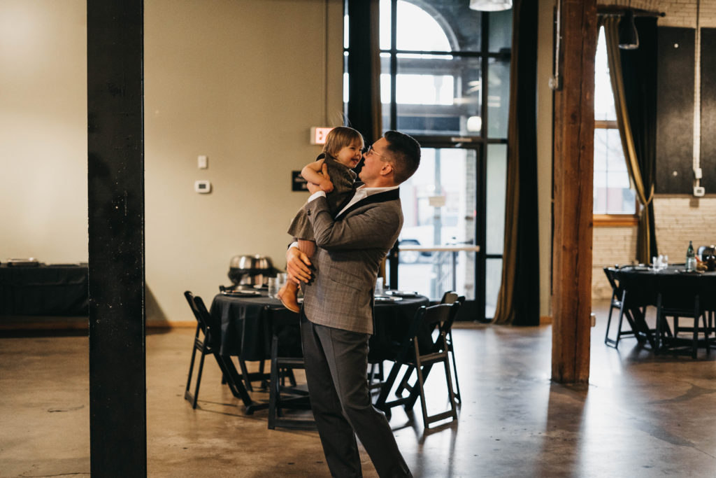 father dances with his daughter during an event at the linen building in downtown boise