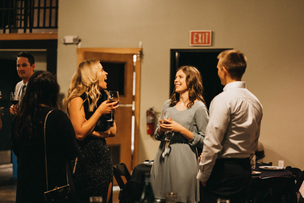 guests chat amongst themselves during the anniversary party at the linen building in boise