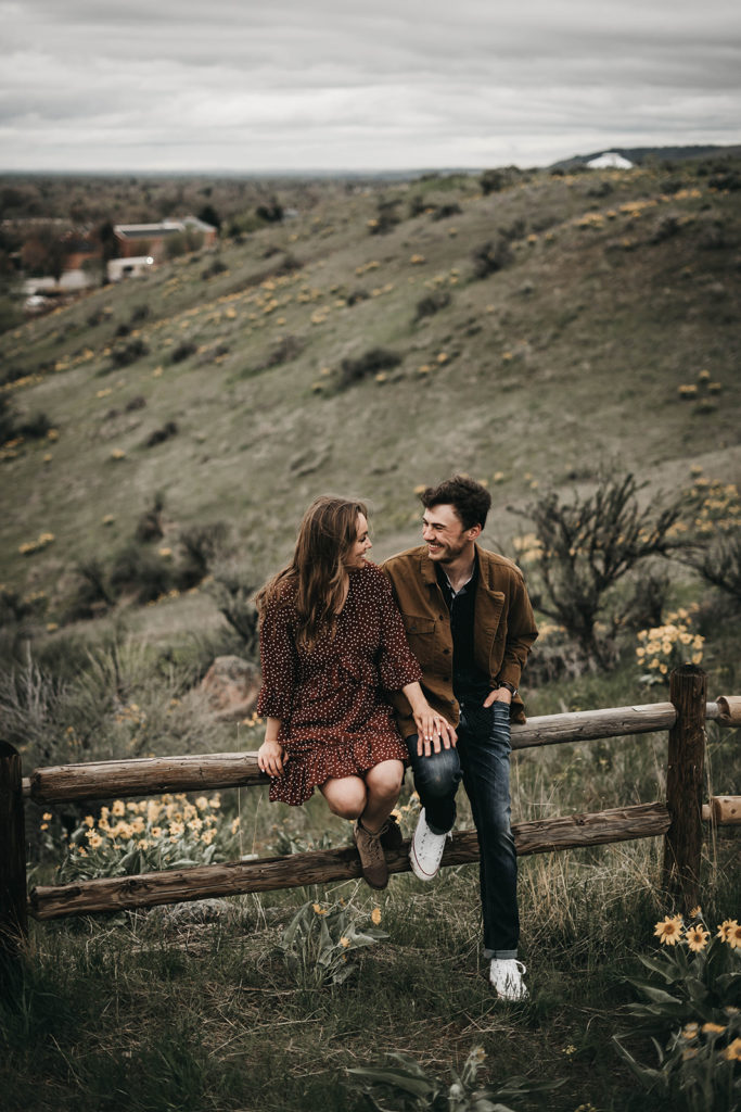 couple smiles at each other overlooking boise