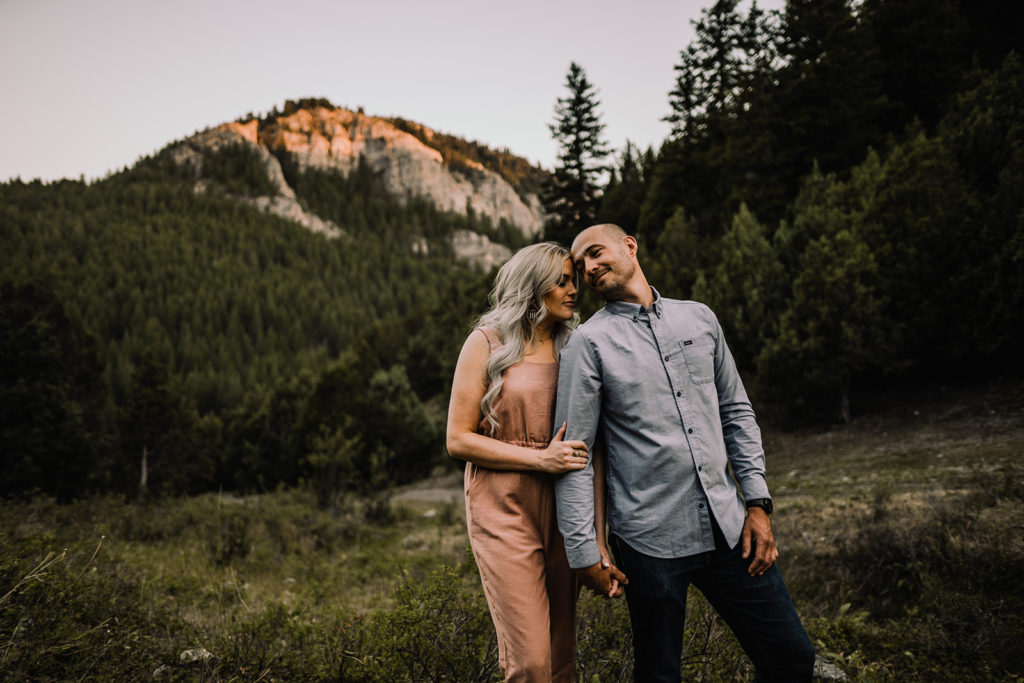 couple poses together during their wolverine canyon engagement session outside of Idaho falls