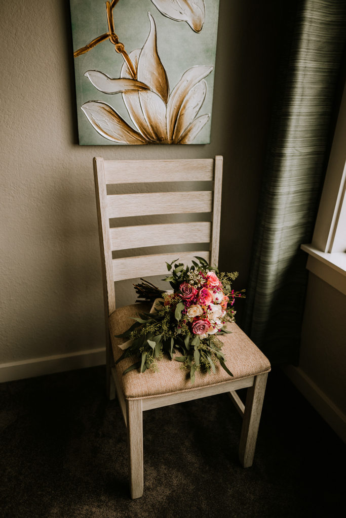 bridal bouquet resting on a chair