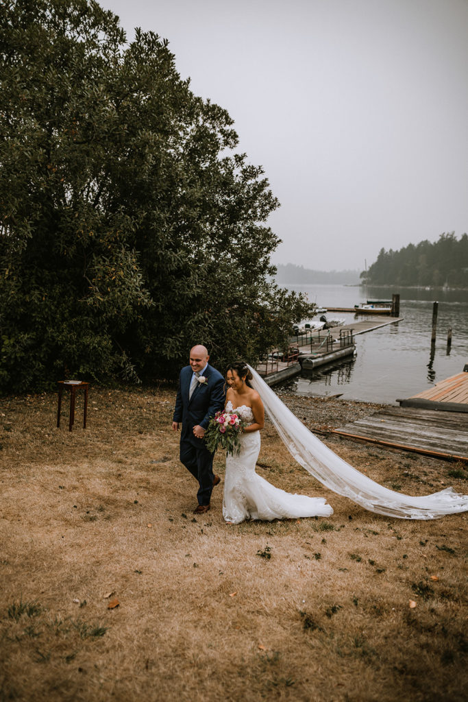 Newlyweds begin walking back towards their Airbnb after their ceremony