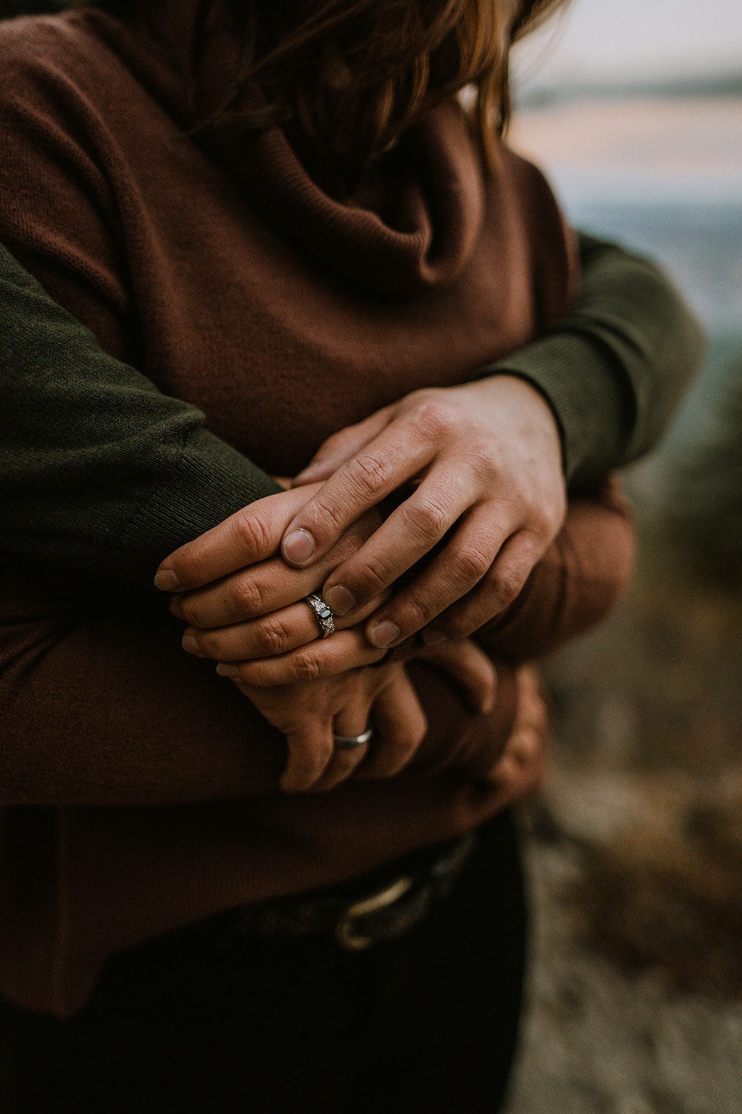 detail shot of husband and wife's rings during their couple session