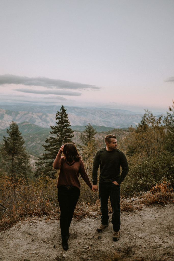 couple stands together holding hands during their Bogus Basin couple session