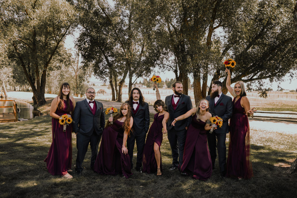 Fun group shot of bridesmaids and groomsmen during an intimate donnelly wedding