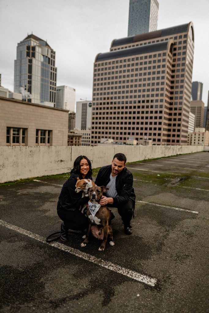 Couple takes photos with their dogs during their Downtown Seattle engagement session
