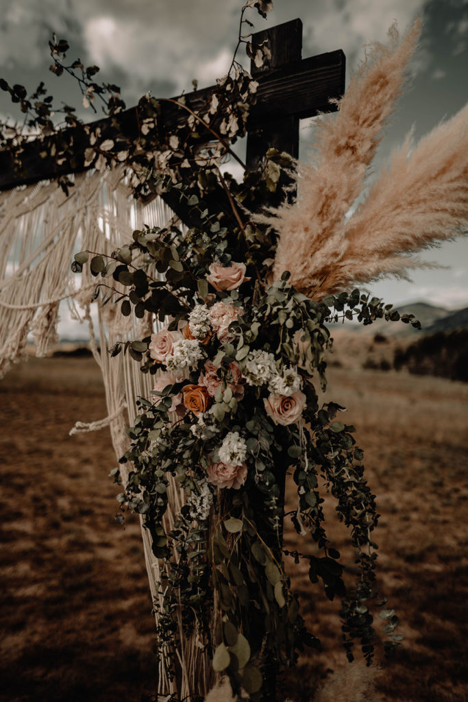 Detail shot of the black and boho inspired floral ceremony archway by Amber Everly Design