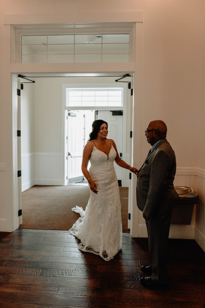 Bride has a first look with her father at the Tamarack Resort chapel