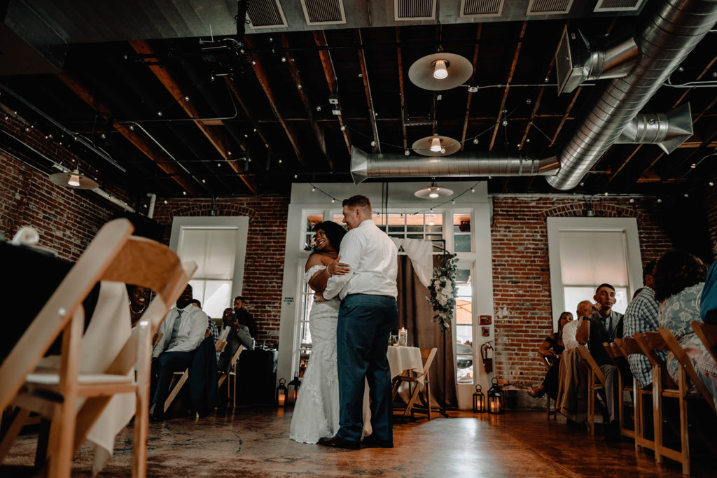 Bride and groom share their first dance on the dance floor in Beside bardenay