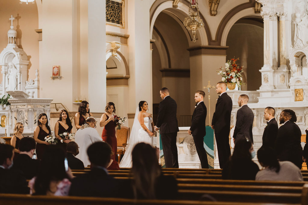 Intricate details abound in St. Aloysius church during a wedding ceremony