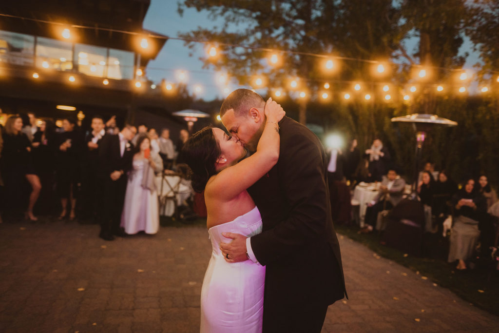Bride and groom share their first dance on the dance floor of Beacon Hills during their fall reception