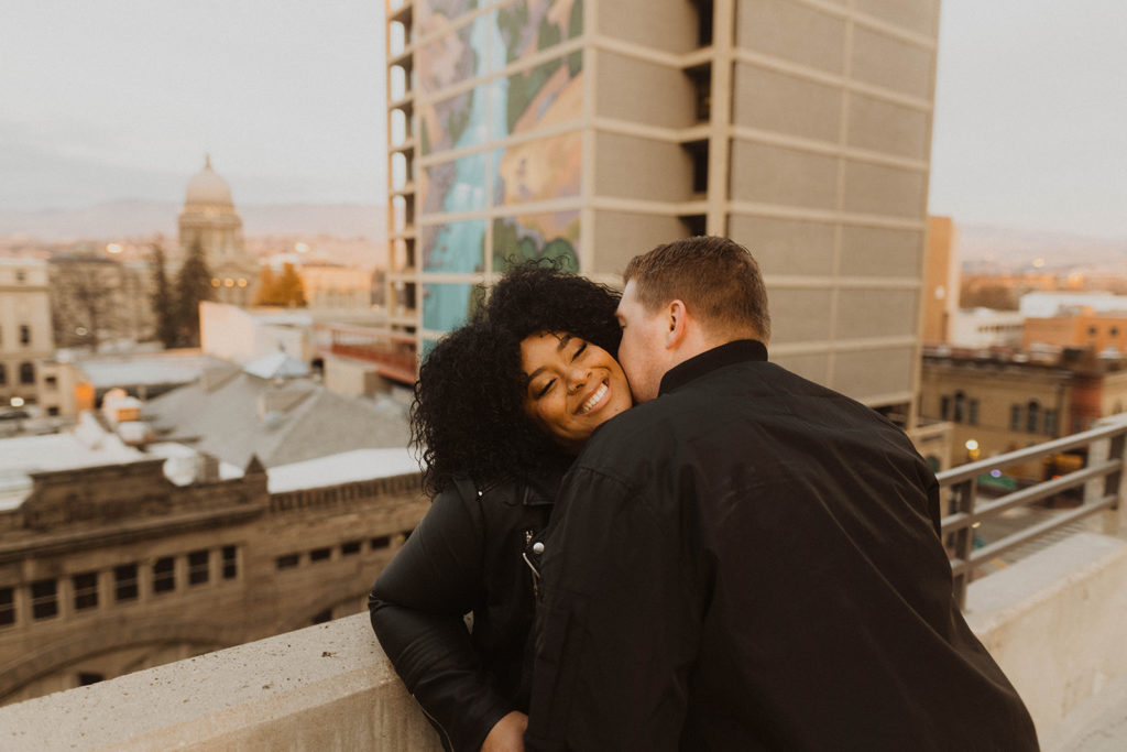 couple laughs together during their downtown boise couple session