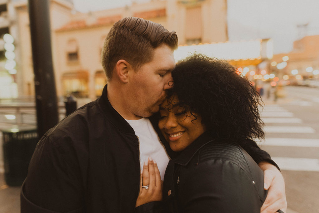 couple kisses in front of the egyptian theater during their downtown boise couple session