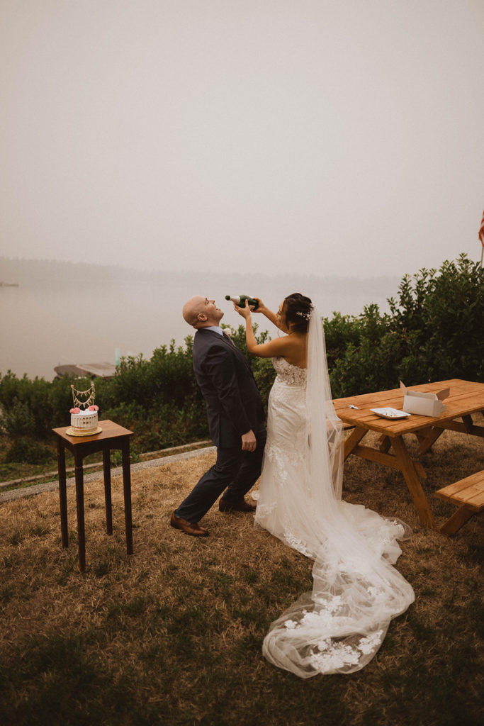 bride and groom drink champagne during their elopement reception as they elope in Idaho