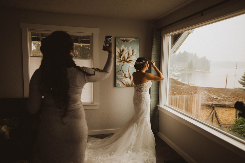 Wedding Hair stylist Alxandra Victoria takes a photo of the Tacoma elopement bride after finishing getting her ready