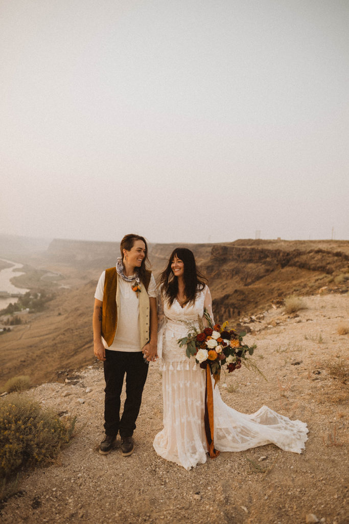 couple stands on the rim of the swan falls canyon during their elopement