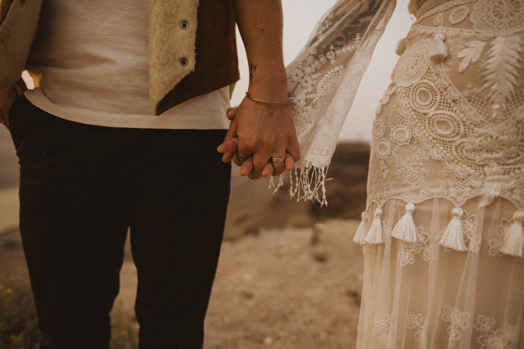 close up shot of brides holding hands during their snake river canyon elopement