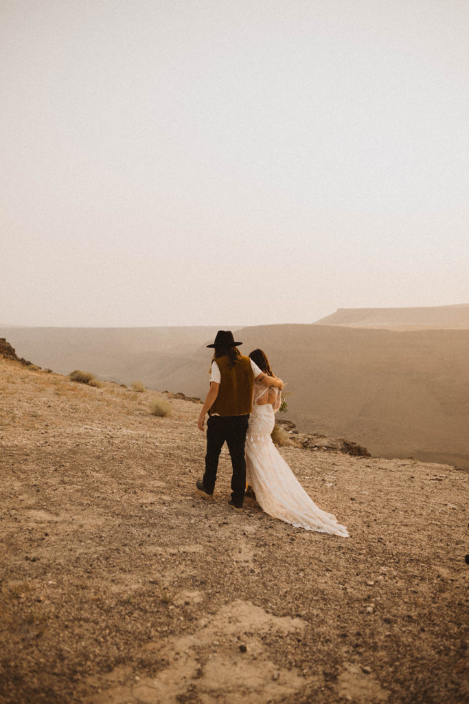 idaho lgbtq brides walk along the canyon during their elopement
