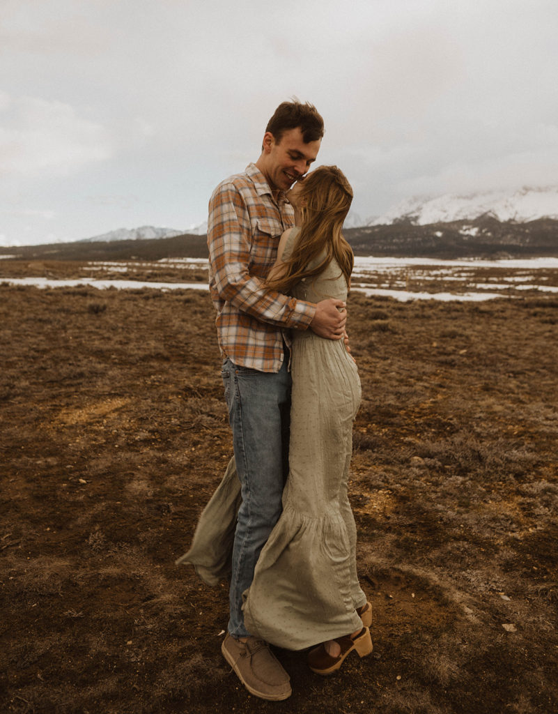 couple hugs each other during their idaho engagement session