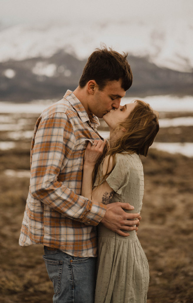 couple kisses during their idaho engagement session